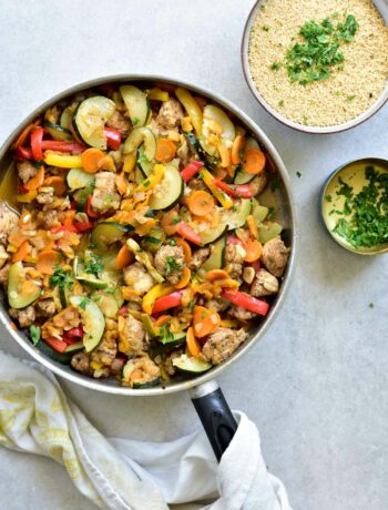 moroccan chicken with apricots and vegetables in a pan