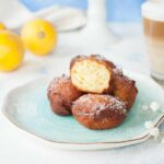 lemon ricotta doughnuts on a blue plate