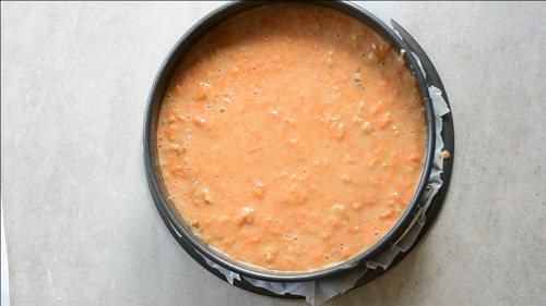 carrot cake batter in a springform pan