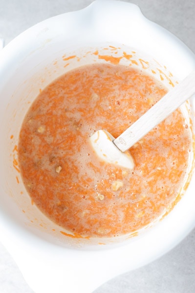 wet ingredients for carrot cake in a white bowl