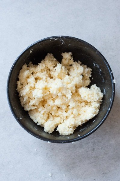 coconut crumble in a black bowl