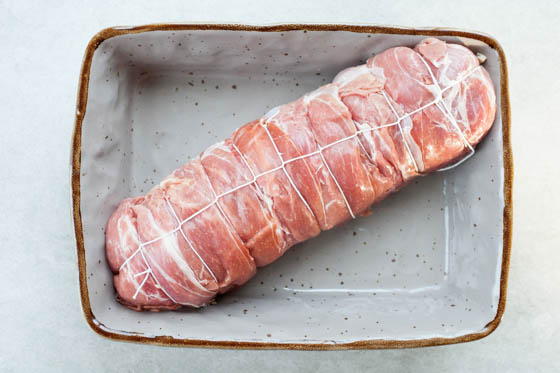 turkey roulade wrapped in Parma ham in a baking dish