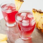 Cranberry juice cocktail on a silver plate.