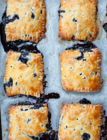 blueberry hand pies on a baking tray