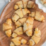 Rogaliki cookies on a chopping board.