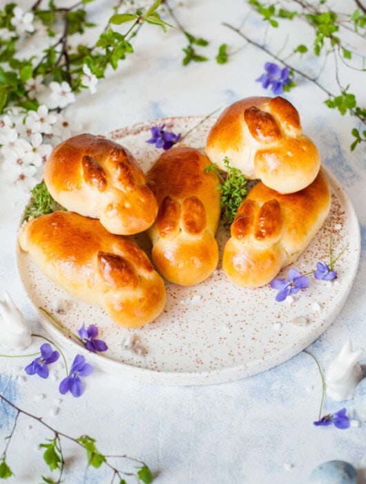 Easter bunny rolls on a white plate.