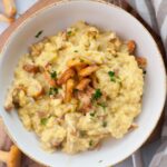 Chanterelle scrambled eggs in a white bowl.