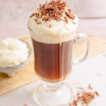 Bourbon coffee with whipped cream in a coffee mug.