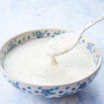 Ranch dressing in a white-blue bowl.