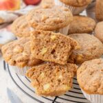 Healthy apple muffins on a black cooling rack.