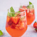 Strawberry basil cocktail in a glass.