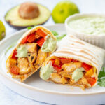 Chicken Fajita wraps on a white plate.