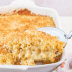 Gruyere mac and cheese in a white casserole dish.