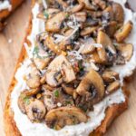 Mushroom toast on a wooden board.