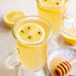 Two glasses with hot toddy cocktail.