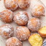 Ricotta doughnuts on a white plate.