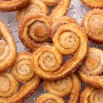 Palmiers cookies on a cooling rack.