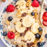 Banana oatmeal in a white bowl.