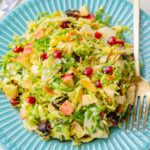 Brussels sprout salad on a blue plate.